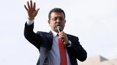 Reuters Istanbul Mayor Ekrem Imamoglu, from the main opposition, the Republican People's Party (CHP), addresses his supporters on top of a bus after giving testimony to judicial authorities at the Justice Palace, known as Caglayan Courthouse, in Istanbul, Turkey, January 31, 2025.
