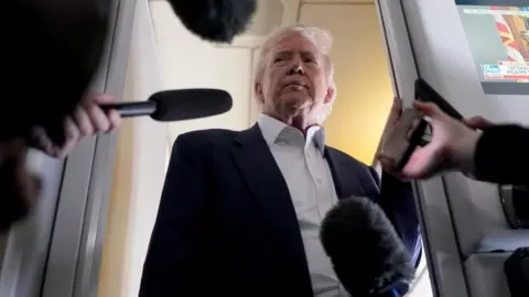 Reuters US President Donald Trump speaks to reporters aboard Air Force One on a flight to Rome. Photo: 25 April 2025