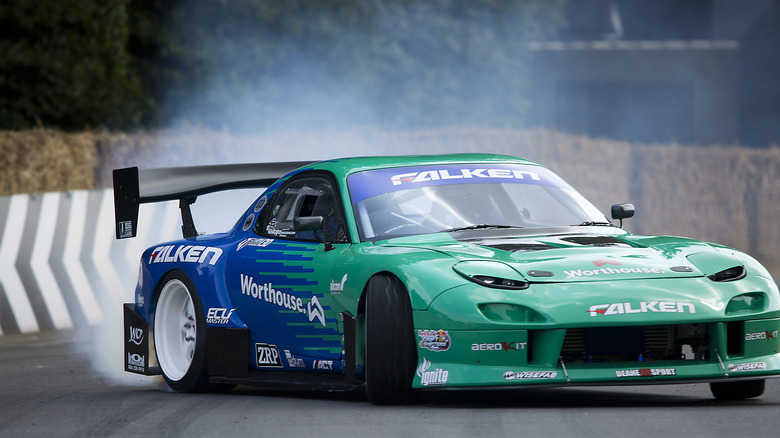 13th July : 1995 Mazda RX-7 entered and driven by James Deane at Goodwood on July 13th, 2018 in Chichester, England.